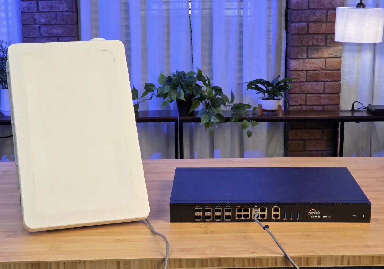 A CBRS 5G radio next to a Peplink Balance 1350 EC appliance